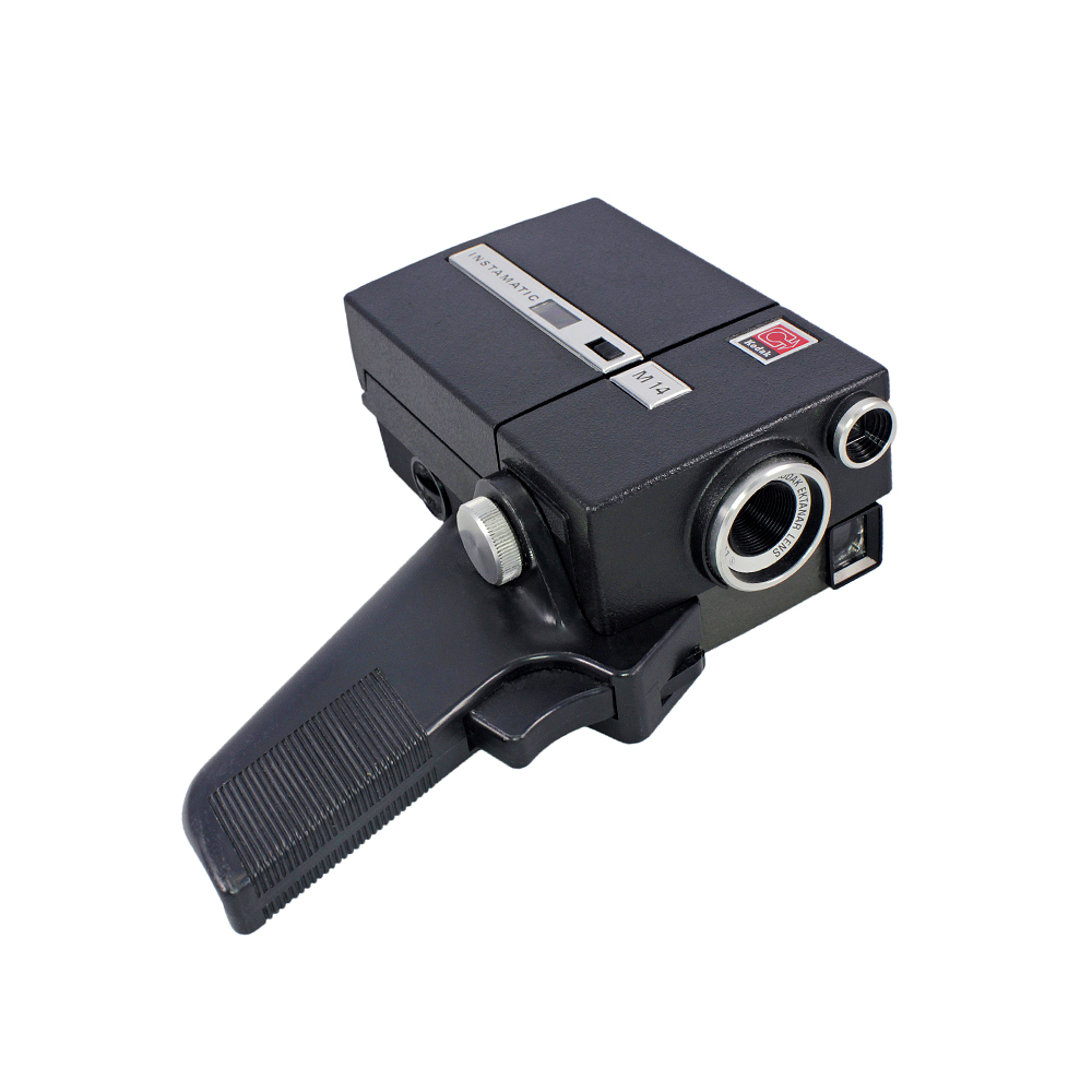 1970'ler Amerika üretimi Orijinal tutma sapı, deri hard-case çantası ve kitapçığıyla, Ektanar 2.7/14mm optik lensli Kodak Instamatic M14 8mm film kamerası.